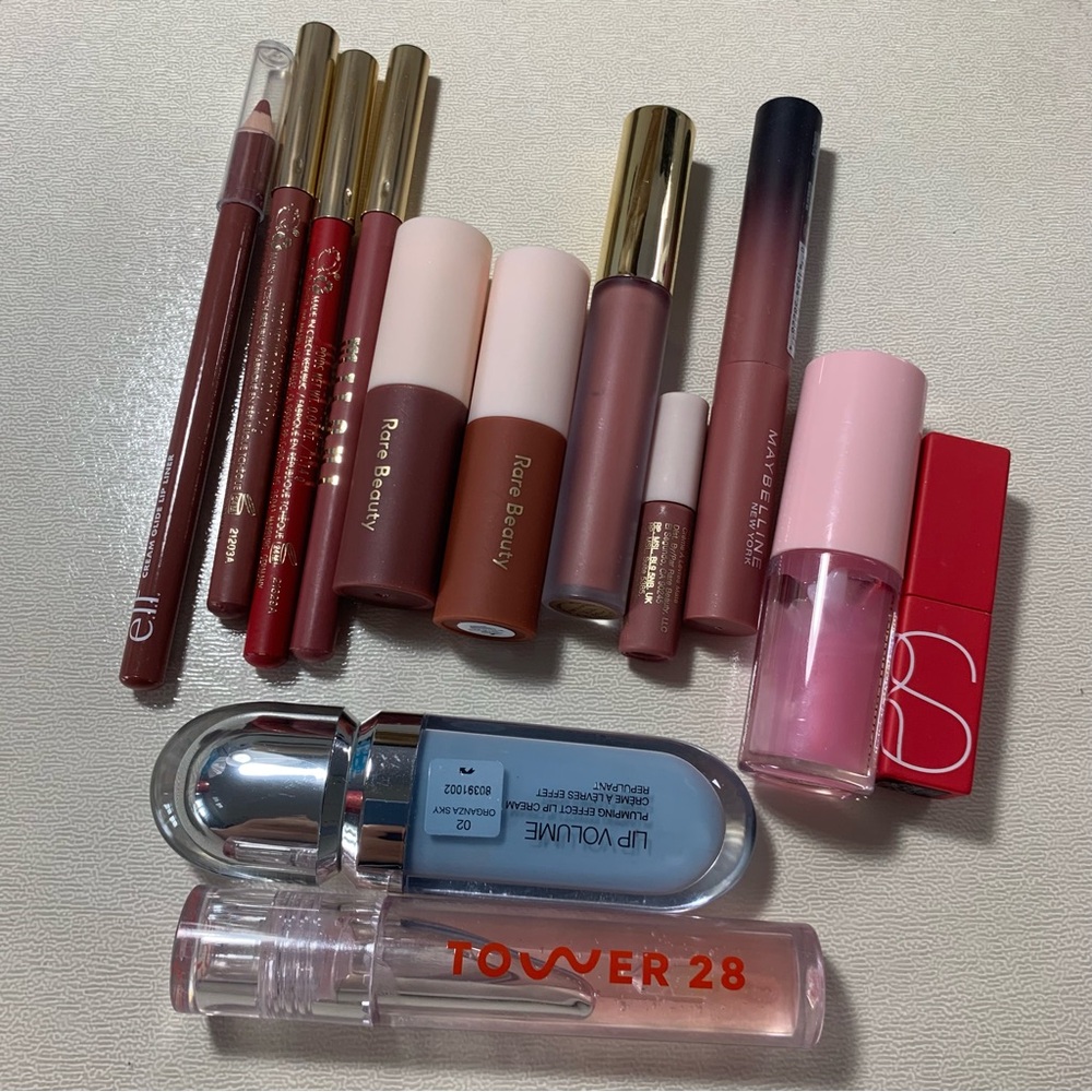 Variety of lip products - gloss, lipstick, liners.